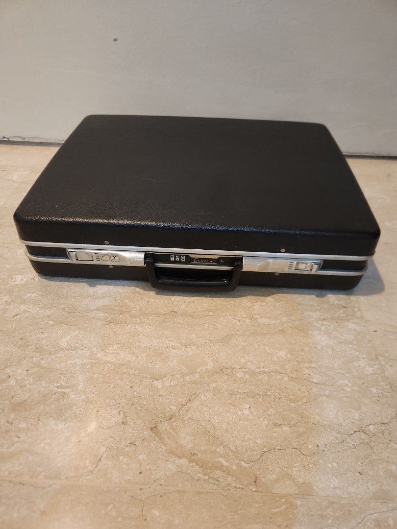 Briefcase (Category: Briefcases) located in Singapore. Submitted by moving_2026 (Listing ID 1456920669, Image 3). Description: - Brand: Echolac - Type: Briefcase - Color: Black - Condition: Excellent (minimal signs of wear) - Features: Secure combination lock, durable construction - Style: Classic and professional - Meetup available at Stevens MRT or Tanglin Community Club.