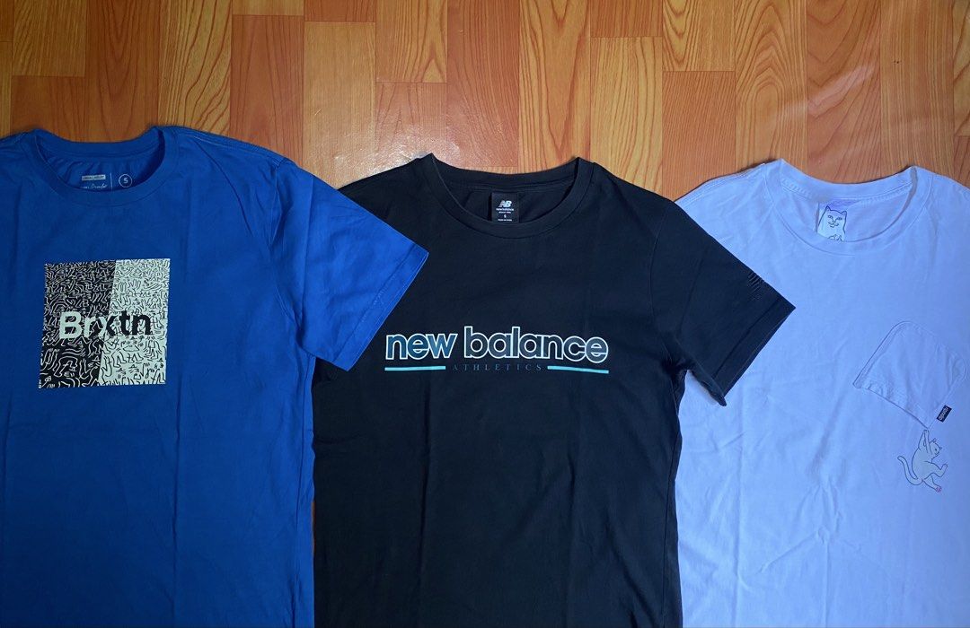Brixton, New Balance, and Ripndip T-shirts Bundle (Category: Tshirts & Polo Shirts ) located in Cebu City. Submitted by monflor (Listing ID 1456871269, Image 2). Description: - Blue Brixton graphic tee with a unique front design. - Black New Balance Athletics tee. - White Ripndip tee with a cool cat graphic. - All tees are short-sleeved and made for comfort. - Ideal for casual everyday outfits. All size small fit also to medium 500 each price.