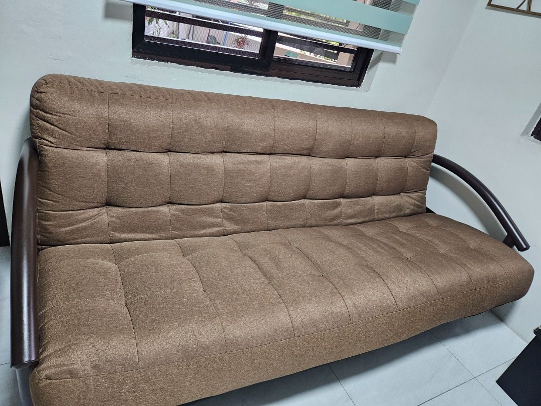 Brown Tufted Sofa Bed with Metal Frame (Category: Sofas) located in Tanza. Submitted by mama_1996sagi (Listing ID 1456828285, Image 2). Description: - Preloved sofa bed in an excellent condition. - Clean and no dents on metal frames. - Stylish brown sofa bed with elegant tufted design. - Durable dark metal frame. - Easily converts into a comfortable bed. - Ideal for small living spaces. - Provides comfortable seating for your living room..