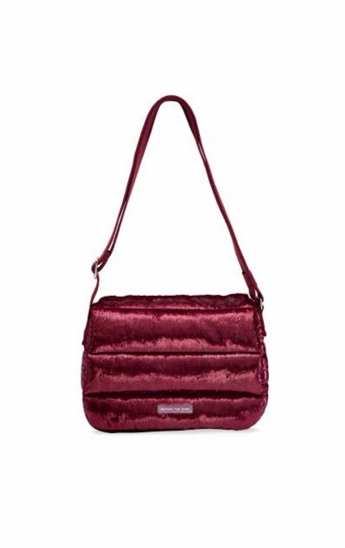 BTV Holiday Maroon Poofy bag (Category: Luxury Bags & Wallets) located in Makati City. Submitted by ck.gudz (Listing ID 1456945968, Image 1). Description: - Stunning burgundy sequin shoulder bag - Padded design with chic horizontal quilting - Adjustable strap for comfortable wear - Small, elegant logo plate on the front - Ideal for evening events or elevating everyday outfits - Dimensions: Approximately 10 inches wide x 6 inches tall.