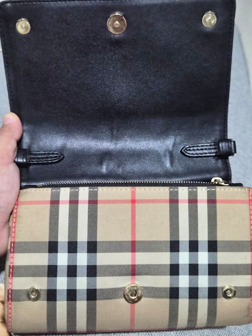 Burberry Haymarket Check Wallet (Category: Luxury Bags & Wallets) located in Caloocan City. Submitted by rmdesilva (Listing ID 1456795852, Image 3). Description: Classic Burberry Haymarket check wallet. Beige and red plaid pattern. Gold hardware details. Interior has card slots and a zip compartment. Leather trim. Snap closure. Great for organizing essentials..
