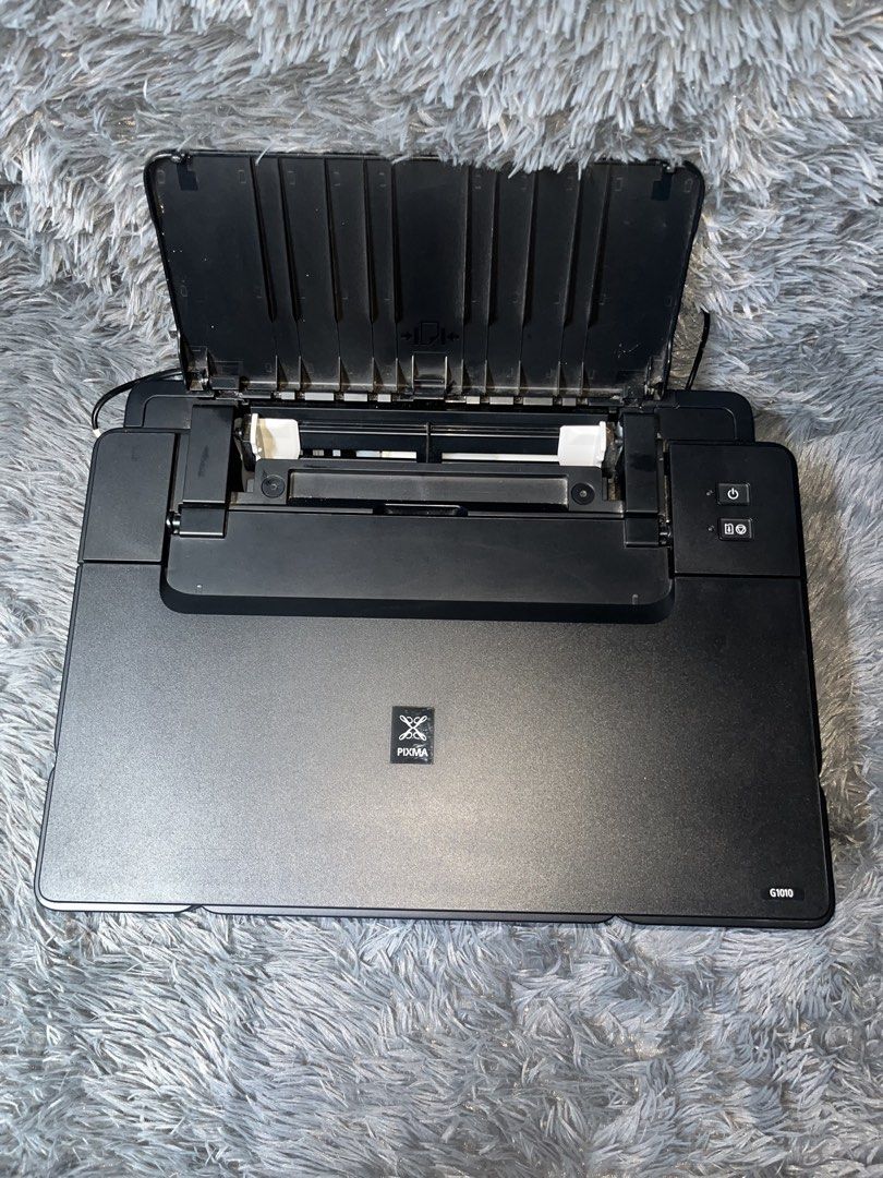 Canon Pixma G1010 (Category: Printers, Scanners & Copiers) located in Manila. Submitted by knnth.fnds (Listing ID 1456886970, Image 2). Description: Canon Pixma G1010 (Print Only) Refillable Ink Extra Ink Included Honest Issue: Hindi lang nag pprint sa color ng magenta. (see photo for sample print).