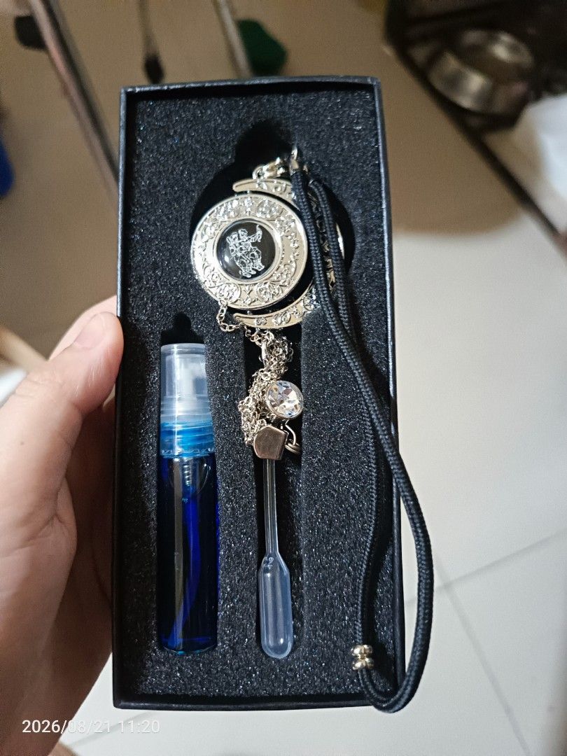 Car Perfume Diffuser with Zodiac Pendant and Essential Oil (Category: Home Fragrance) located in Caloocan City. Submitted by wjsixteen (Listing ID 1456837292, Image 2). Description: - Car perfume diffuser set - Includes zodiac pendant - Comes with a small bottle of blue essential oil - Includes a dropper - Box features Chinese characters for 'Car Perfume' - Perfect for keeping your car smelling fresh.