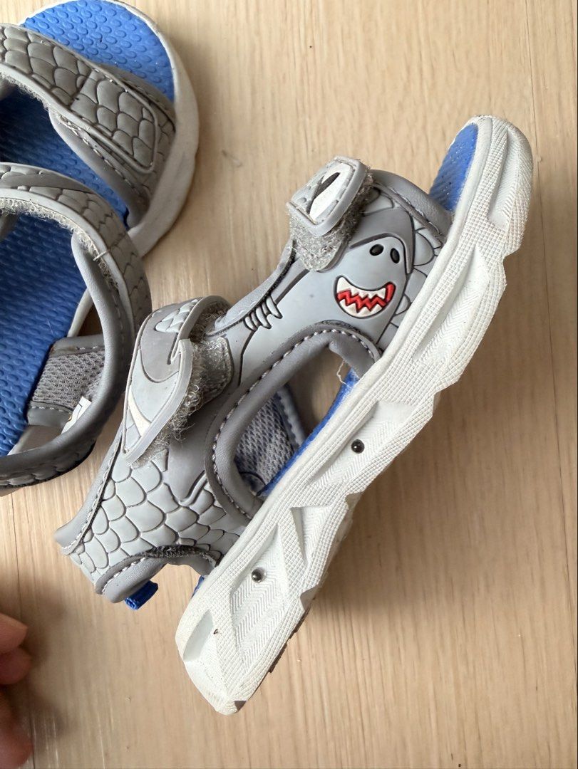 Carter's Kids Shark Sandals Size 7 (Category: Babies & Kids Fashion) located in San Pedro. Submitted by tabacheengcheeng (Listing ID 1456780764, Image 3). Description: - Brand: Carter's - Size: 7kids - Color: Blue and Grey - Design: Fun shark on the side - Closure: Easy velcro straps - Features: Good grip soles - Ideal for: Summer adventures Nailaw .