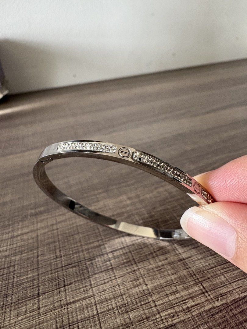 Cartier Love Bracelet with Crystals (Category: Bracelets) located in Manila. Submitted by samasamm (Listing ID 1456841701, Image 3). Description: - Not sure if original. (gifted to me lng with no box) - Silver-toned bracelet - Cartier engraving - Small crystals along the band - Classic screw motif detail - Ideal for stacking with other bracelets RFS: gifted to me but i dont wear bracelets.
