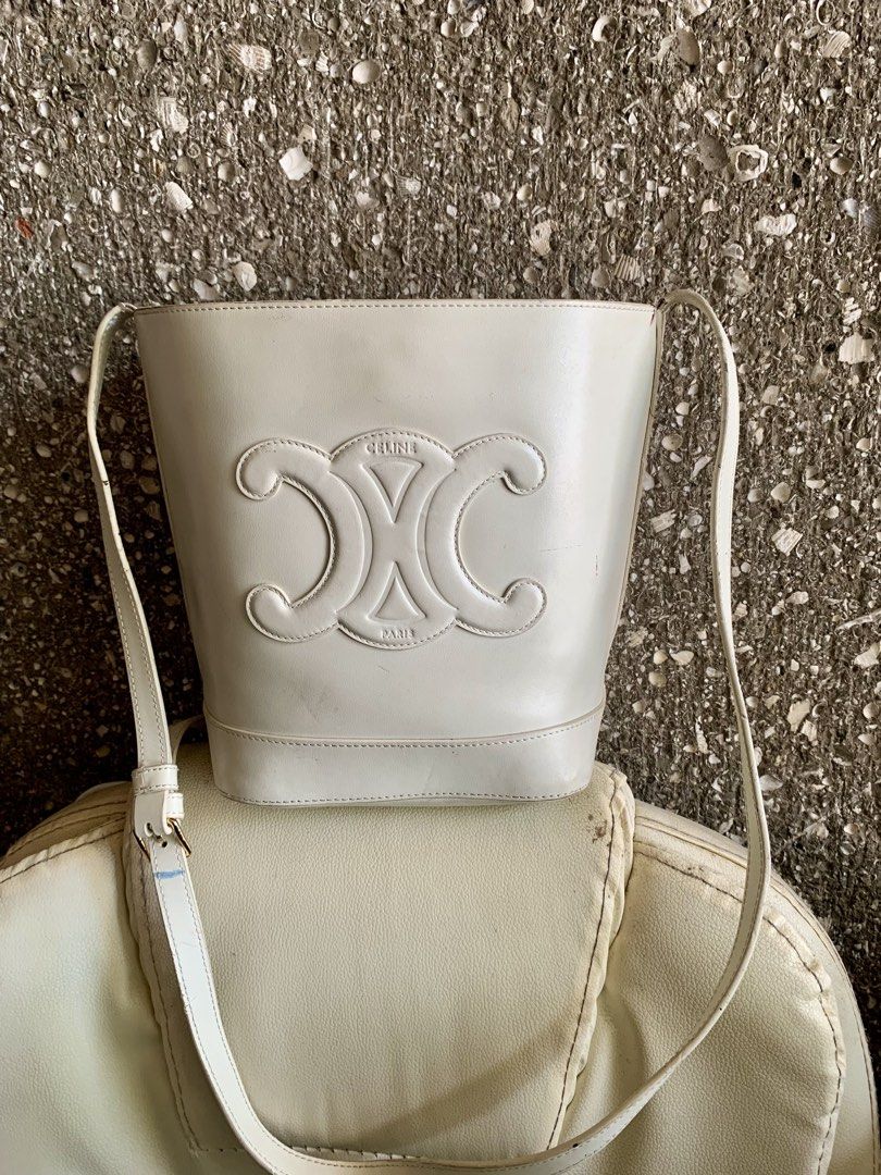 Celine Triomphe Shoulder Bags (White & Black) (Category: Luxury Bags & Wallets) located in General Santos City (Dadiangas). Submitted by mj_luxuries_bags_and_stuff (Listing ID 1456900679, Image 2). Description: - Two Celine shoulder bags for bundle sale‼️ - White bucket style bag with embossed Triomphe logo. - Black flap bag with elegant gold hardware. - Both bags feature adjustable straps for comfortable wear. - Versatile pieces suitable for eve