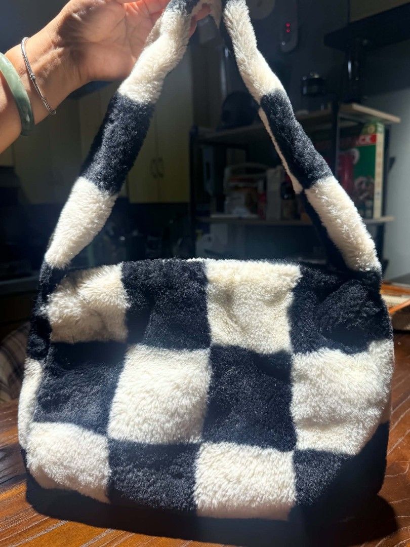 Checkerboard Fuzzy Shoulder Bag (Category: Shoulder Bags) located in Manila. Submitted by thea_gabrielle (Listing ID 1456792465, Image 2). Description: Super cute fuzzy shoulder bag. Black and white checkerboard pattern. Soft material, feels great. Great size for essentials. Perfect for adding a fun vibe to any outfit. Easy to carry..