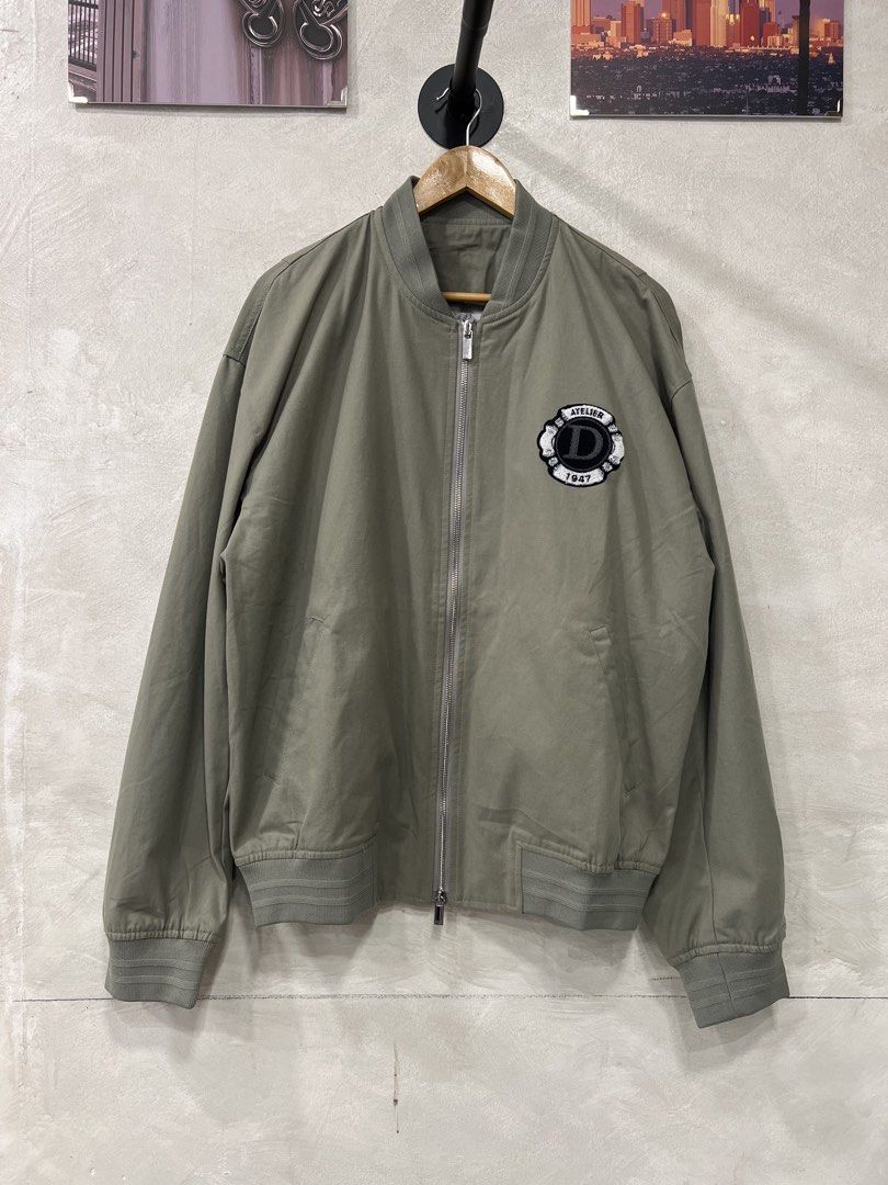 Christian Dior 24SS Cotton Blend Bomber Jacket (Category: Coats, Jackets and Outerwear) located in Manila. Submitted by -handpick- (Listing ID 1456874566, Image 3). Description: This is a Christian Dior 24SS Cotton Blend Bomber Jacket in gray featuring a prominent tonal “Christian Dior Couture” cursive embroidery on the back. Size : 50 Dimensions : Length: 28 inches Width: 24.5 inches Shoulder : 23 inches Sleeve : 25.5 inches Sign of wear in good