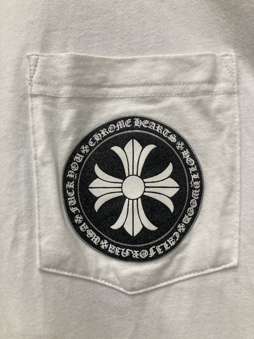 Chrome Hearts White Pocket Tee (Category: Tshirts & Polo Shirts ) located in Quezon City. Submitted by janisu0303 (Listing ID 1456946264, Image 3). Description: - Chrome Hearts Cross Pocket tee - 21 x 27 dimes - 4500 php - got this from japan thrift shop Not sure if it’s authentic - 9/10 condition - Iconic cross logo on chest pocket - Large graphic logo on the back - 'Fuck You' detail on the sleeve - Made from good quality cotton - Ideal for casu