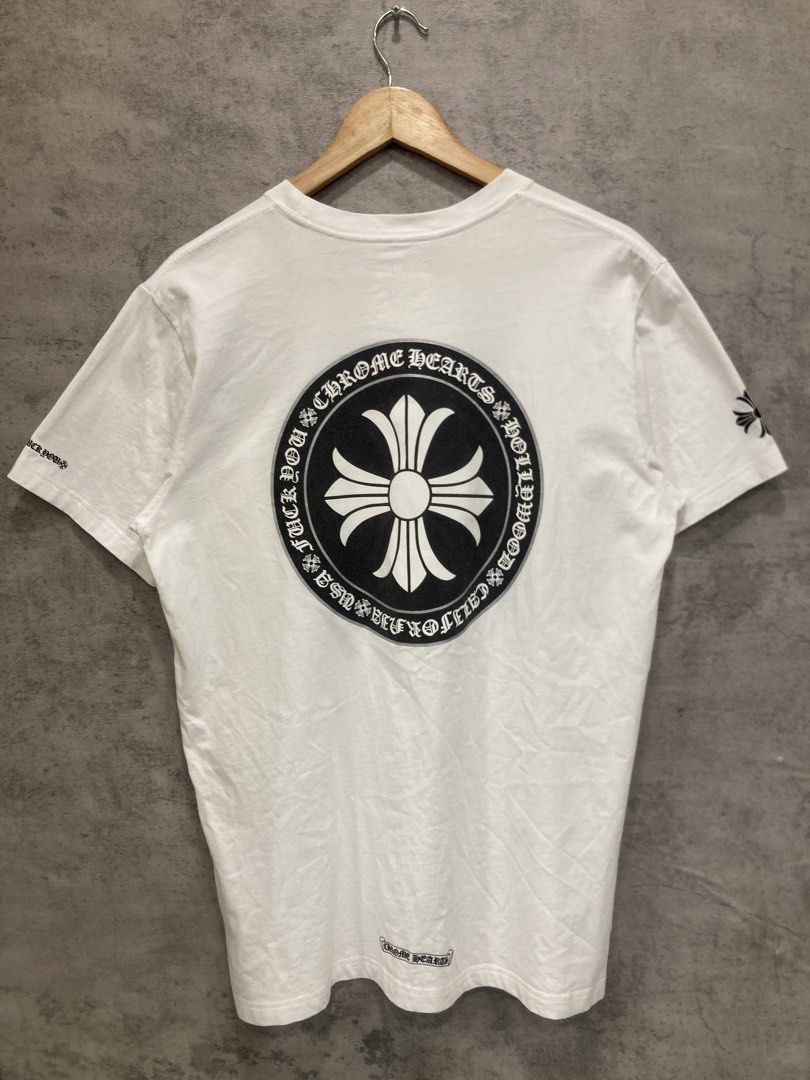 Chrome Hearts White Pocket Tee (Category: Tshirts & Polo Shirts ) located in Quezon City. Submitted by janisu0303 (Listing ID 1456946264, Image 2). Description: - Chrome Hearts Cross Pocket tee - 21 x 27 dimes - 4500 php - got this from japan thrift shop Not sure if it’s authentic - 9/10 condition - Iconic cross logo on chest pocket - Large graphic logo on the back - 'Fuck You' detail on the sleeve - Made from good quality cotton - Ideal for casu
