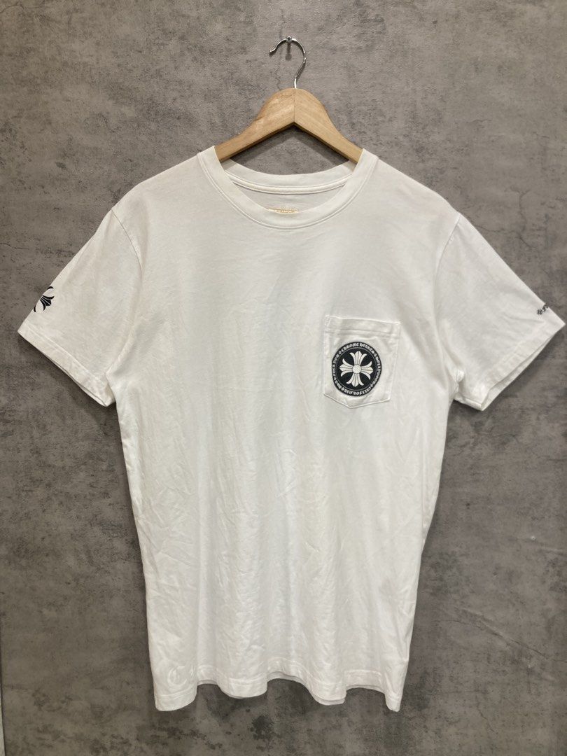 Chrome Hearts White Pocket Tee (Category: Tshirts & Polo Shirts ) located in Quezon City. Submitted by janisu0303 (Listing ID 1456946264, Image 1). Description: - Chrome Hearts Cross Pocket tee - 21 x 27 dimes - 4500 php - got this from japan thrift shop Not sure if it’s authentic - 9/10 condition - Iconic cross logo on chest pocket - Large graphic logo on the back - 'Fuck You' detail on the sleeve - Made from good quality cotton - Ideal for casu