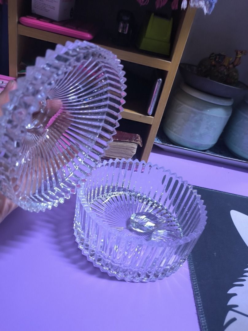 Clear Glass Candy Dish with Lid (Category: Other Kitchenware & Tableware) located in Manila. Submitted by silent_vonachiles (Listing ID 1456900735, Image 2). Description: - Beautiful clear glass candy dish - Features a ribbed design all over - Lid has a decorative finial - Great for storing small items or as a decorative piece - Perfect for your vanity or desk - Measures approximately 5 inches tall with lid on.