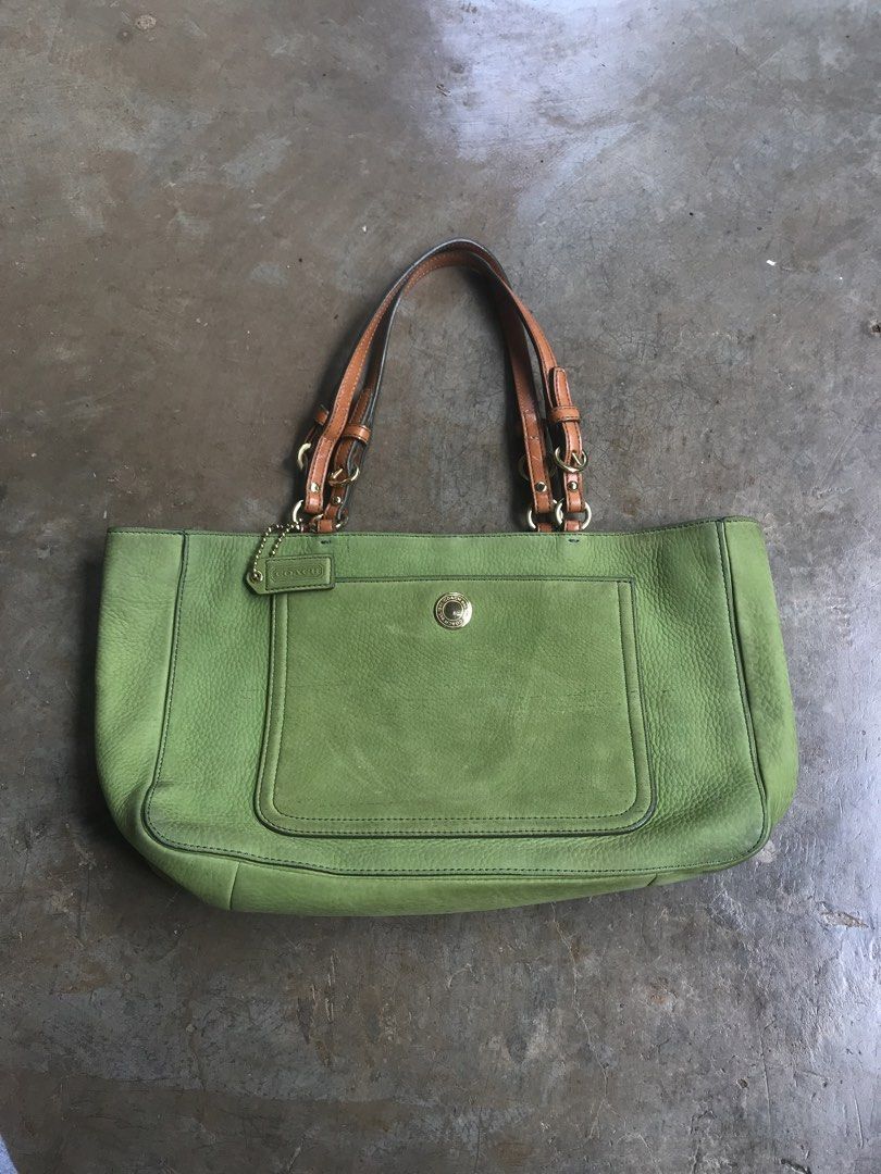 COACH CHELSEA TOTE (Category: Luxury Bags & Wallets) located in Aurora. Submitted by thrillthriftfinds123 (Listing ID 1456832013, Image 1). Description: The bag in the image is a Vintage Coach Chelsea Tote, specifically crafted in a green nubuck or suede leather finish. It features a prominent front slip pocket secured with a snap-button closure, dual leather shoulder straps with metallic buckle accents, and a matching green leather Coach hangtag