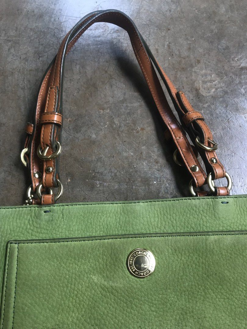 COACH CHELSEA TOTE (Category: Luxury Bags & Wallets) located in Aurora. Submitted by thrillthriftfinds123 (Listing ID 1456832013, Image 2). Description: The bag in the image is a Vintage Coach Chelsea Tote, specifically crafted in a green nubuck or suede leather finish. It features a prominent front slip pocket secured with a snap-button closure, dual leather shoulder straps with metallic buckle accents, and a matching green leather Coach hangtag