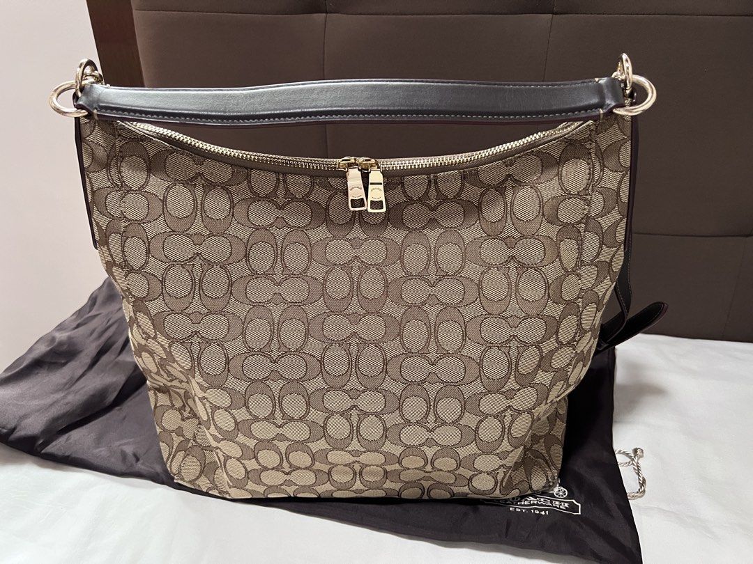 Coach hobo bag (Category: Cross-body Bags) located in Cabanatuan. Submitted by hellorhea (Listing ID 1456785744, Image 1). Description: Preloved good as new. With card and dust bag. With removable strap. .