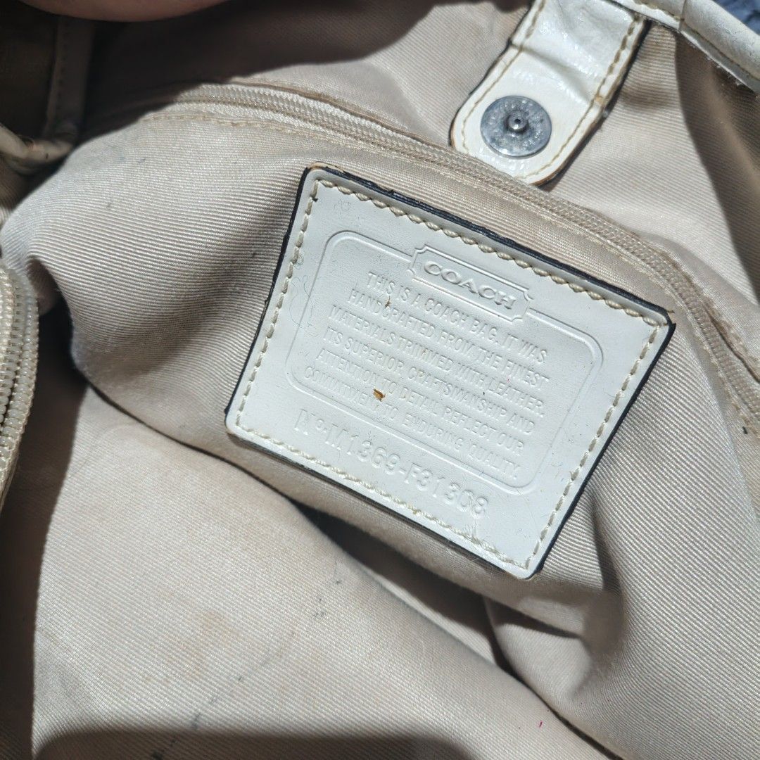 Coach Monogram Canvas & Leather Trim Tote Bag (Category: Luxury Bags & Wallets) located in Butuan. Submitted by luxestreet04 (Listing ID 1456825384, Image 2). Description: - Authentic Coach tote bag - Beige and brown monogram canvas - White leather trim with snakeskin accent stripe - Drawstring sides - Interior zippered pocket - Some signs of wear on leather trim and handles - Clean interior - Ideal for everyday use.