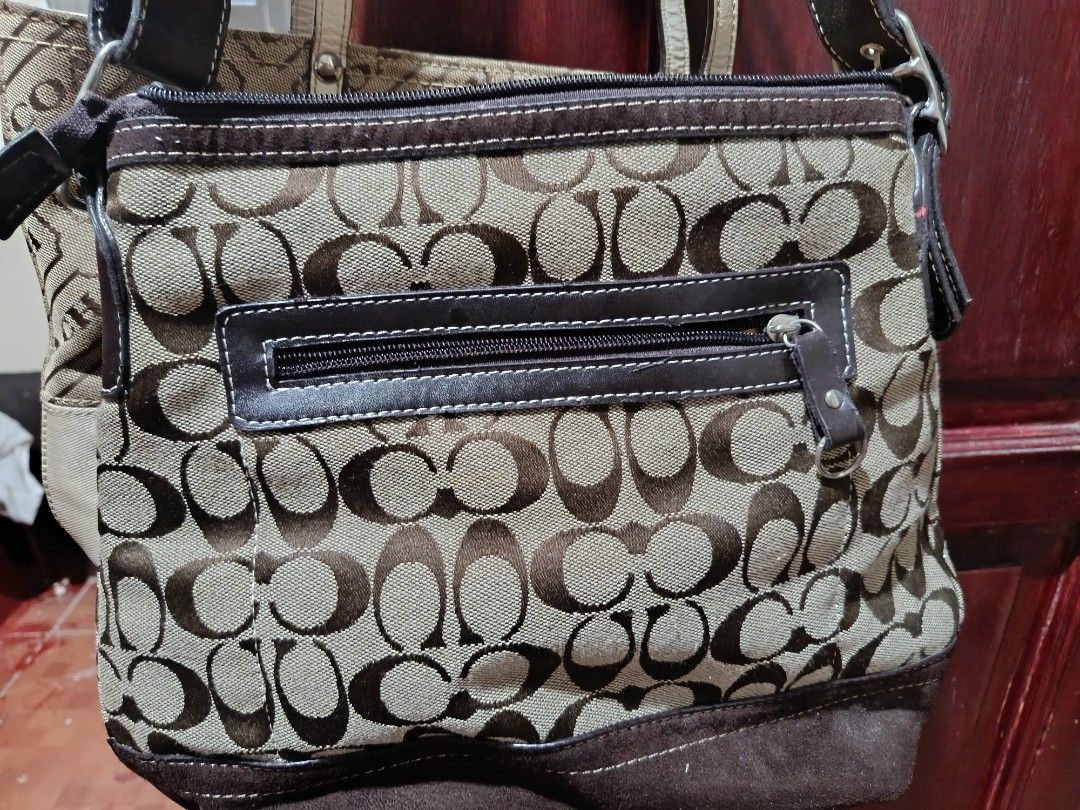 Coach Monogram Canvas Tote Bag (Category: Luxury Bags & Wallets) located in Manila. Submitted by empyuyubaron (Listing ID 1456879893, Image 3). Description: - Classic Coach tote bag - Signature brown and tan monogram pattern - Cream leather trim and handles - Spacious interior, great for everyday or travel - Shows some signs of wear on bottom corners and trim.