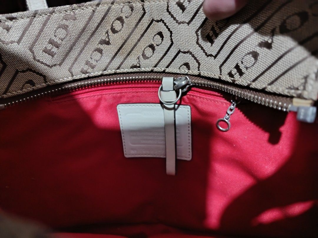 Coach Monogram Canvas Tote Bag (Category: Luxury Bags & Wallets) located in Manila. Submitted by empyuyubaron (Listing ID 1456879893, Image 2). Description: - Classic Coach tote bag - Signature brown and tan monogram pattern - Cream leather trim and handles - Spacious interior, great for everyday or travel - Shows some signs of wear on bottom corners and trim.
