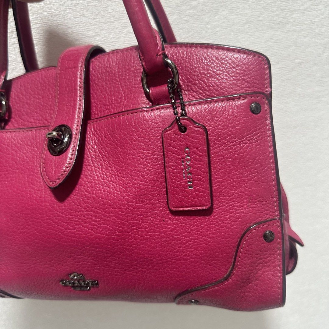 Coach Pebble Leather Handbag - Pink (Category: Luxury Bags & Wallets) located in Marikina City. Submitted by bry_lei26 (Listing ID 1456908521, Image 2). Description: - Genuine pink pebbled leather Coach handbag - Classic top handles - Secure turn-lock closure at the front - Spacious zippered main compartment - Interior pockets for organization - Includes original Coach hangtag - Ideal for everyday use -rfs: decluttering with minimal signs of usag