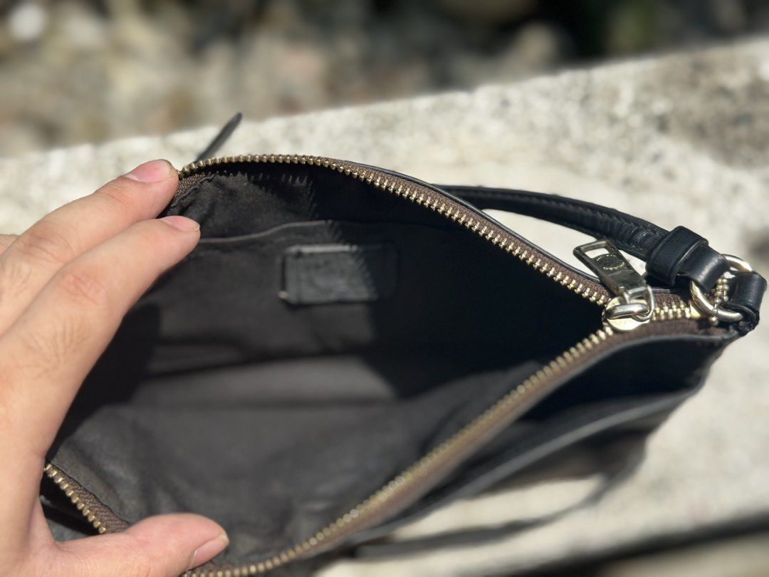 Coach purse (Category: Luxury Bags & Wallets) located in Pasig City. Submitted by lancer501 (Listing ID 1456814294, Image 3). Description: - Brand: Coach - Type: Vanity Bag - Color: Brown signature pattern - Condition: Great, pre-loved - Features: Compact and stylish design - Perfect for everyday use -Comes with coach envelope addon -creed is damaged by age -Shipping shouldered by buyer.