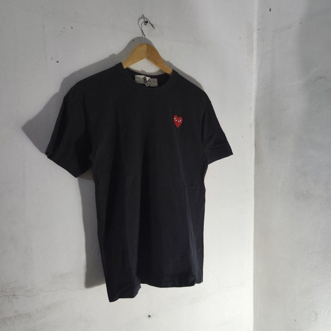 Comme Des Garcons Play Heart Patch T-Shirt (Category: Luxury Apparel) located in Antipolo. Submitted by soon2byours_ (Listing ID 1456914642, Image 1). Description: Dimensions (laid flat): ‎Pit to Pit: 18½" ‎Length: 26¼" ‎[Medium on tag] ‎ ‎Flaws: need rewash (due to long-term storage) ‎Color Rate: 10/10 ‎Condition: EXCELLENT ‎ ‎COLOR MAY VARY DUE TO LIGHTING!.