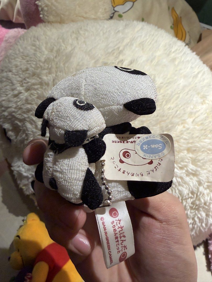 Cute Panda Plush Toy (Category: Plushies & Soft Toys) located in Makati City. Submitted by squishycorner (Listing ID 1456873221, Image 2). Description: - Adorable panda plush toy featuring a smaller panda atop a larger one. - Made with soft white fabric and classic black details for eyes and ears. - Please note: The larger panda has some small marks on its face. - A Winnie the Pooh plush toy is also available for sale..