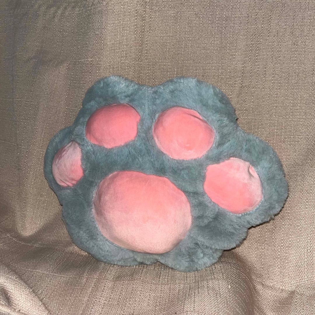 Cute Plush Paw Pillow Cushion (Category: Plushies & Soft Toys) located in Manila. Submitted by ahviliara (Listing ID 1456831723, Image 3). Description: - Super soft plush material - Adorable paw design with contrasting pink pads - Perfect for adding a fun accent to your couch or bed - Ideal size for a throw pillow.
