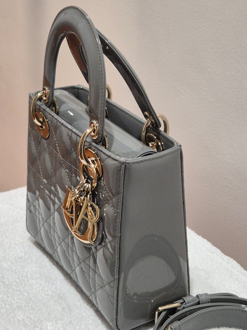 Dior Grey Patent Lady Dior Mini Bag (Category: Luxury Bags & Wallets) located in Quezon City. Submitted by belovedmanila (Listing ID 1456868205, Image 3). Description: - Grey patent leather mini Lady Dior bag - Iconic cannage stitching - Gold-tone hardware with Dior charms - Detachable shoulder strap included - Chic and compact design - Ideal for evenings or elevating any outfit.