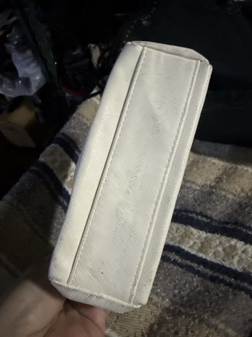 Dior White Cosmetic Bag Pouch (Category: Others) located in Angeles City. Submitted by migs_font29 (Listing ID 1456815811, Image 3). Description: - White Dior pouch - Textured material - Zipper closure with interior snap button - Small size, ideal for makeup or essentials - Minor marks on exterior and bottom.