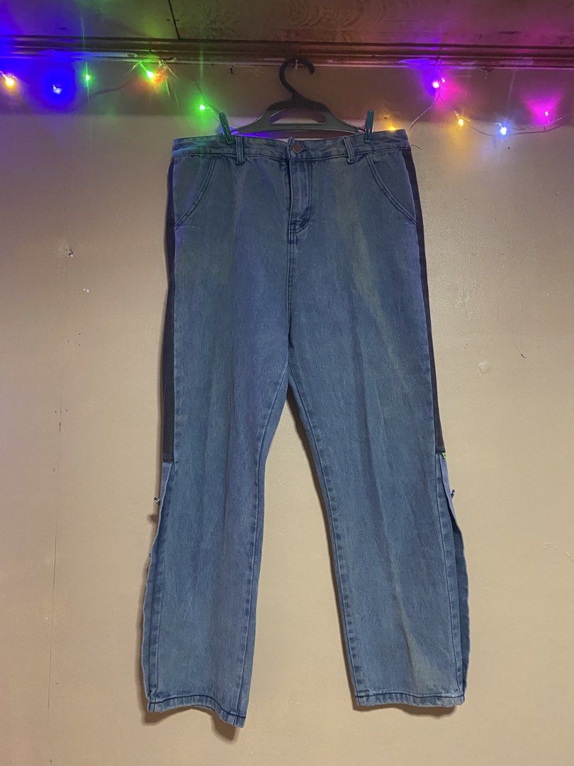DSQUARED2 Denim Jeans with Snap Button Sides (Category: Jeans) located in La Paz. Submitted by itsmejc_0714 (Listing ID 1456812613, Image 1). Description: - Dark wash blue denim jeans - Features a dark side stripe - Snap buttons along the outer leg seam - Two back pockets - Straight leg fit - Ideal for a casual streetwear style.