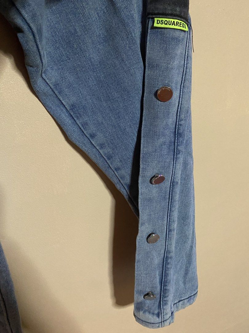 DSQUARED2 Denim Jeans with Snap Button Sides (Category: Jeans) located in La Paz. Submitted by itsmejc_0714 (Listing ID 1456812613, Image 3). Description: - Dark wash blue denim jeans - Features a dark side stripe - Snap buttons along the outer leg seam - Two back pockets - Straight leg fit - Ideal for a casual streetwear style.