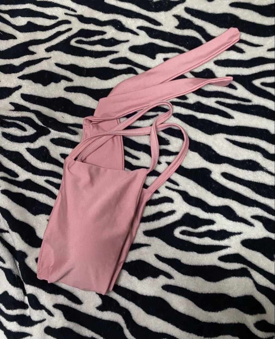 Dusty Pink Criss-Cross Wrap Bikini Top (Category: Bikinis & Swimsuits) located in Manila. Submitted by jelz_ph (Listing ID 1456823905, Image 2). Description: - Fits Small to Medium - Dusty pink / blush colorway - Wide criss-cross front panel with back tie waist - Smooth, stretch swim fabric - Condition: Preloved (8/10) - Good condition with minor surface wear along strap seams.