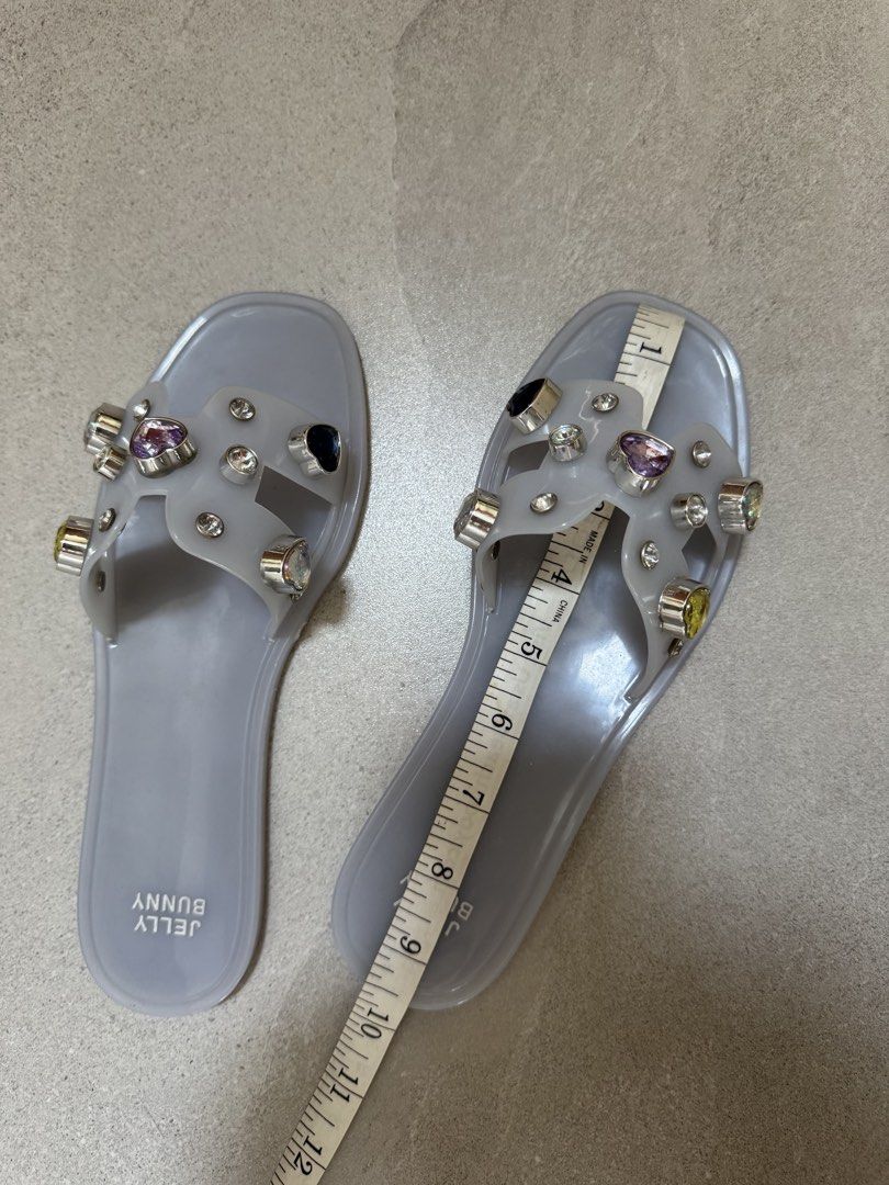 Embellished Jelly Sandals (Category: Flats & Sandals) located in Taguig. Submitted by agclim (Listing ID 1456807375, Image 2). Description: - Grey Jelly Bunny jelly sandals - Decorated with sparkly gems and silver accents - Easy slip-on style - Sole measures approximately 10 inches long - Ideal for casual wear or beach days.