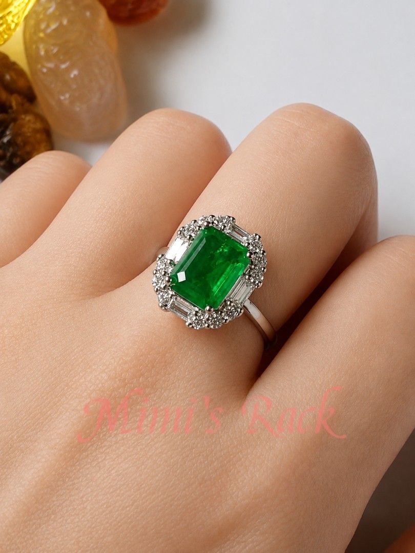 Emerald Luxe Statement Ring | Elegant (Category: Rings) located in Taguig. Submitted by mimisrack (Listing ID 1456824559, Image 2). Description: 💚A truly eye-catching emerald statement ring featuring a vivid green emerald-cut center stone surrounded by a beautifully detailed halo of clear accent stones. 💚✨ -The rich emerald green paired with the surrounding stones gives this ring an elegant, luxurious and timeless look—perfect for anyone who lo