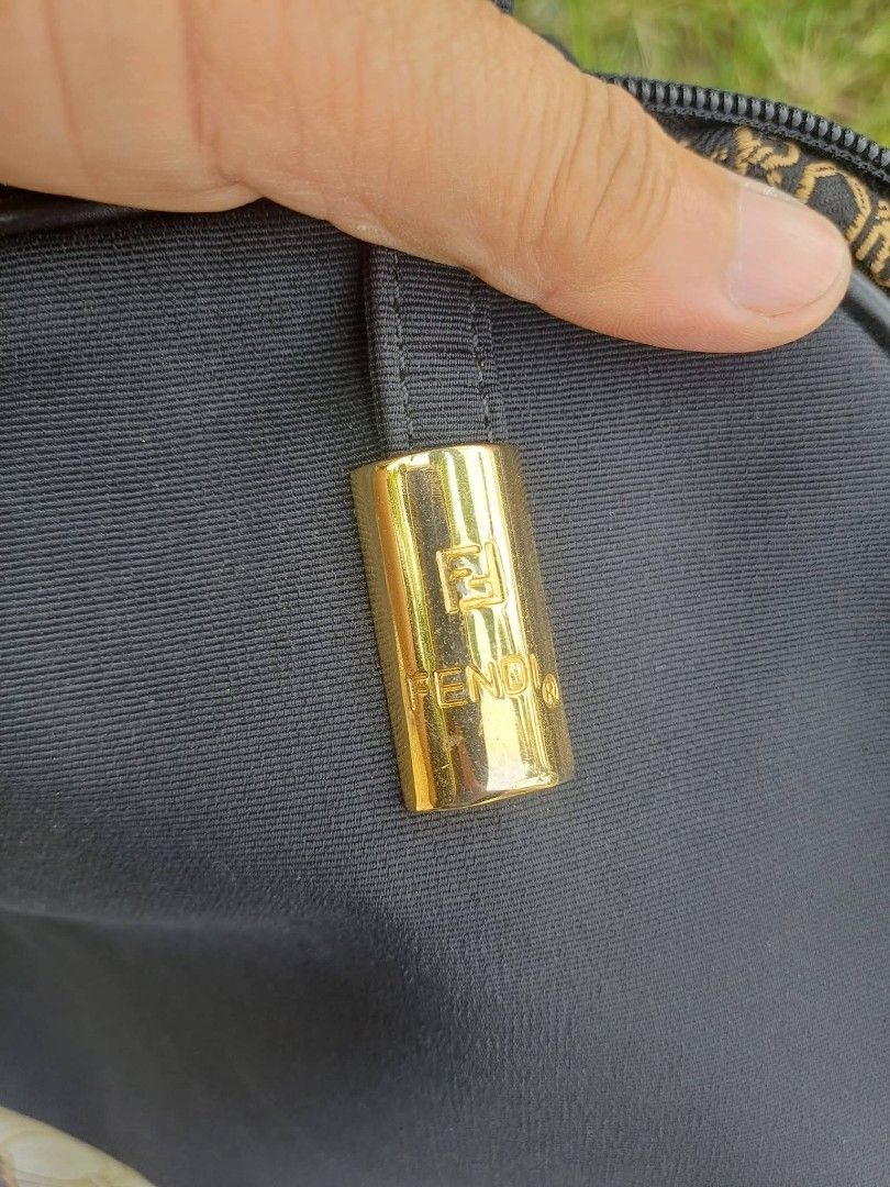 Fendi Zucca Vintage Canvas Shoulder Bag (Category: Luxury Bags & Wallets) located in Bay. Submitted by silverhorse-59c851 (Listing ID 1456855801, Image 3). Description: - Classic Fendi shoulder bag - Black canvas with iconic Zucca pattern lining - Gold hardware details with Fendi logo zipper pull - Interior zip pocket - Great everyday bag.