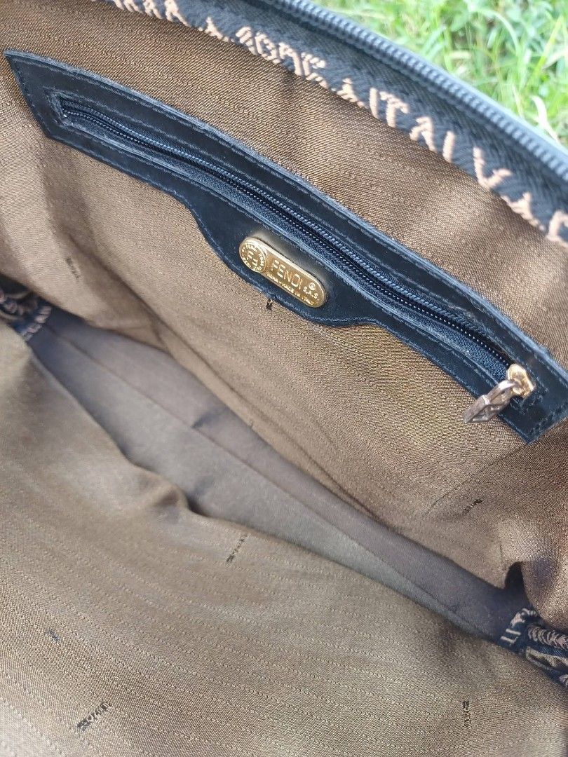 Fendi Zucca Vintage Canvas Shoulder Bag (Category: Luxury Bags & Wallets) located in Bay. Submitted by silverhorse-59c851 (Listing ID 1456855801, Image 2). Description: - Classic Fendi shoulder bag - Black canvas with iconic Zucca pattern lining - Gold hardware details with Fendi logo zipper pull - Interior zip pocket - Great everyday bag.