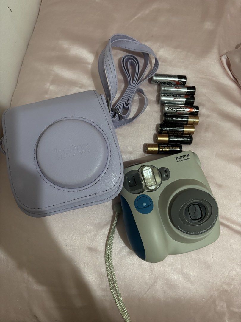 Fujifilm Instax Mini 7S (Category: Cameras) located in Manila. Submitted by michaelaji75732 (Listing ID 1456893071, Image 1). Description: This unit was barely used. No scratch, issue, flaw. All buttons are working. Flash is working. Clear viewfinder. RFS: need cash Inclusions: Camera bag in purple 4 duracell AA batteries (these were the original batteries the camera came with and it’s still working) 4 additional energizer AA batteries.