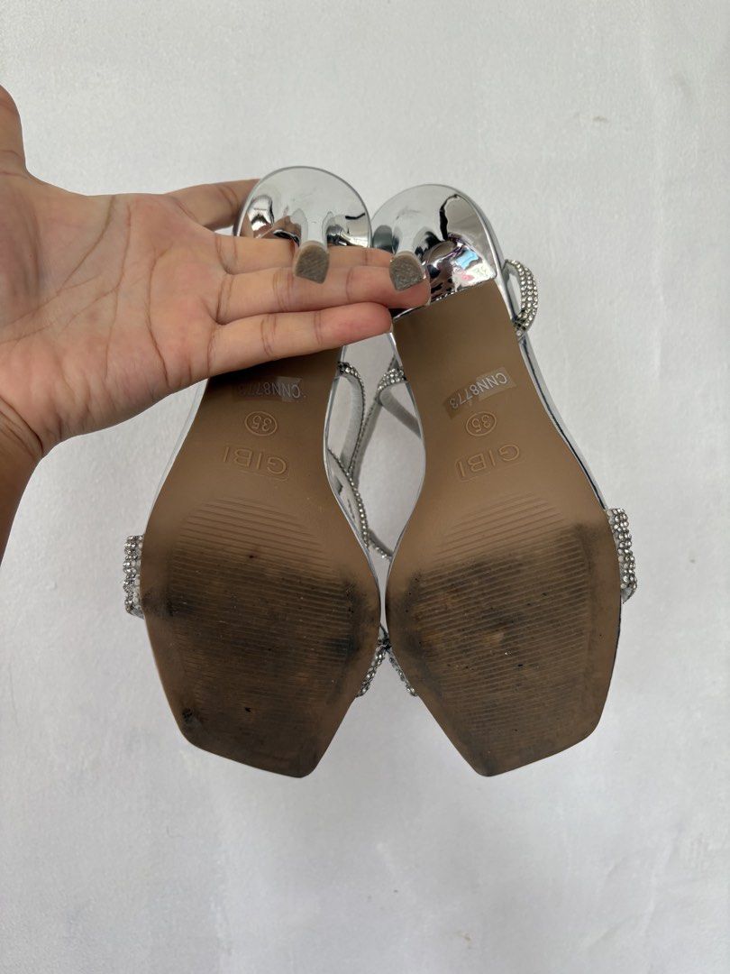 Gibi Silver Long Strap Heels (Category: Heels) located in Pasig City. Submitted by adikinsdeclutter (Listing ID 1456820857, Image 3). Description: Only used once Minor flaw: missing diamonds in some parts but not visible from afar.