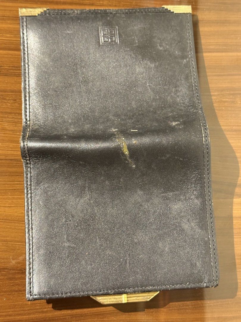 Givenchy fold metal snap wallet (Category: Luxury Bags & Wallets) located in Taguig. Submitted by jhonnybusinessph (Listing ID 1456945640, Image 3). Description: Wts Pre-loved Givenchy wallet 1 fold Black With metal snap coins compartment 3 card slots Size: small Condition: usedgood with minimal issue Scratches and small leather burn (see photos as references) Overall very nice wallet Selling as is (check product before hit purchase).