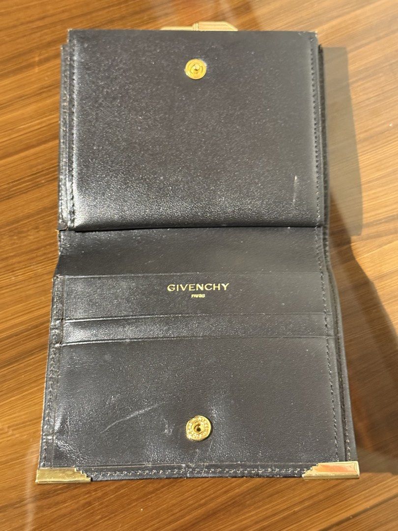 Givenchy fold metal snap wallet (Category: Luxury Bags & Wallets) located in Taguig. Submitted by jhonnybusinessph (Listing ID 1456945640, Image 2). Description: Wts Pre-loved Givenchy wallet 1 fold Black With metal snap coins compartment 3 card slots Size: small Condition: usedgood with minimal issue Scratches and small leather burn (see photos as references) Overall very nice wallet Selling as is (check product before hit purchase).
