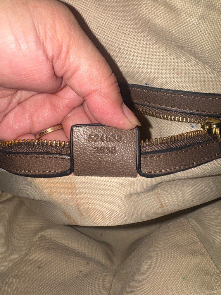Gucci Monogram Canvas & Leather Dome Satchel Bag (Category: Laptop Bags & Sleeves) located in Angeles City. Submitted by migs_font29 (Listing ID 1456936062, Image 3). Description: - Authentic Gucci GG monogram canvas bag - Brown leather trim - Signature green and red stripe detail - Interior shows some signs of wear and staining - Zipper closure - Serial number visible inside - Made in Italy.