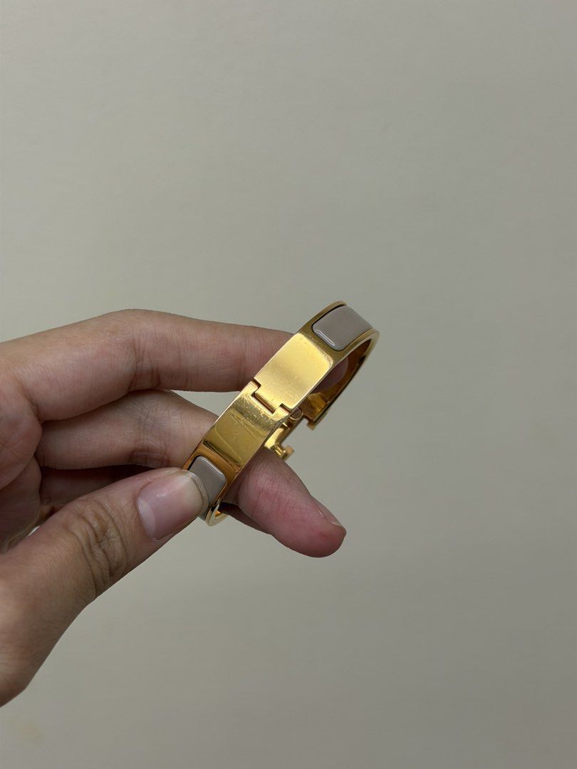 Hermes Clic Clac Etoupe H Bracelet (Category: Luxury Accessories) located in Manila. Submitted by tashvintagefinds (Listing ID 1456932310, Image 3). Description: - Authentic Hermes Clic Clac H Bracelet - Etoupe Color - With dustbag and box - With hairline scratches - Nego.