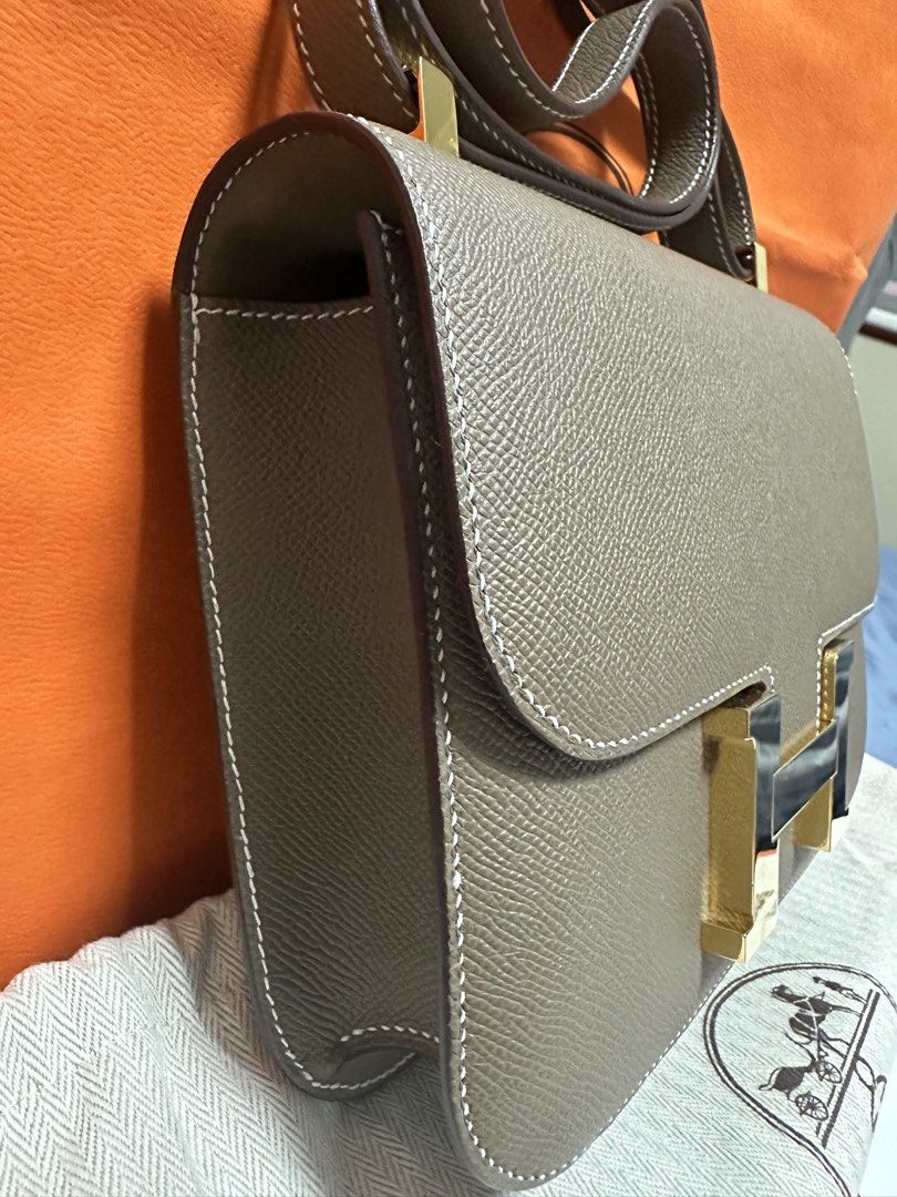 Hermes Constance 24 Stamp U (2022)New Version (Category: Luxury Bags & Wallets) located in Quezon City. Submitted by closet_luxury (Listing ID 1454954271, Image 2). Description: - Authentic Hermes Constance bag -Etoupe Ghw Stamp U(2022) - Comes with original box, dust bag, and authenticity cards -with Certificate of Authenticity ( Legitgrails).
