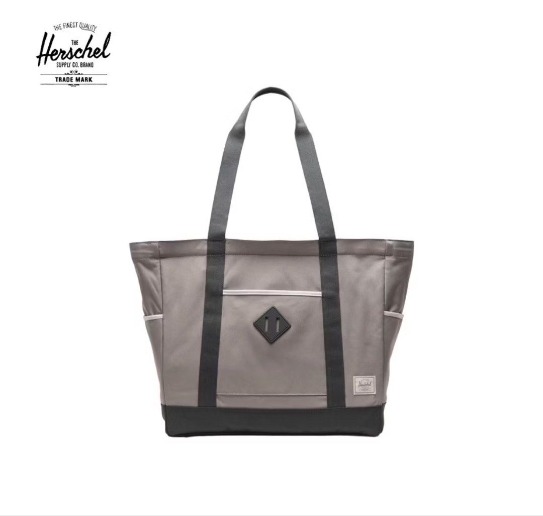 Herschel Supply Co. Tote Bag Grey (Category: Tote Bags) located in Makati City. Submitted by ja_declutters (Listing ID 1456953344, Image 1). Description: - Grey Herschel tote bag - Ample interior space - Convenient side pockets (ideal for water bottles/umbrellas) - Reinforced base for durability - Versatile for everyday use or travel - Clean and simple aesthetic.