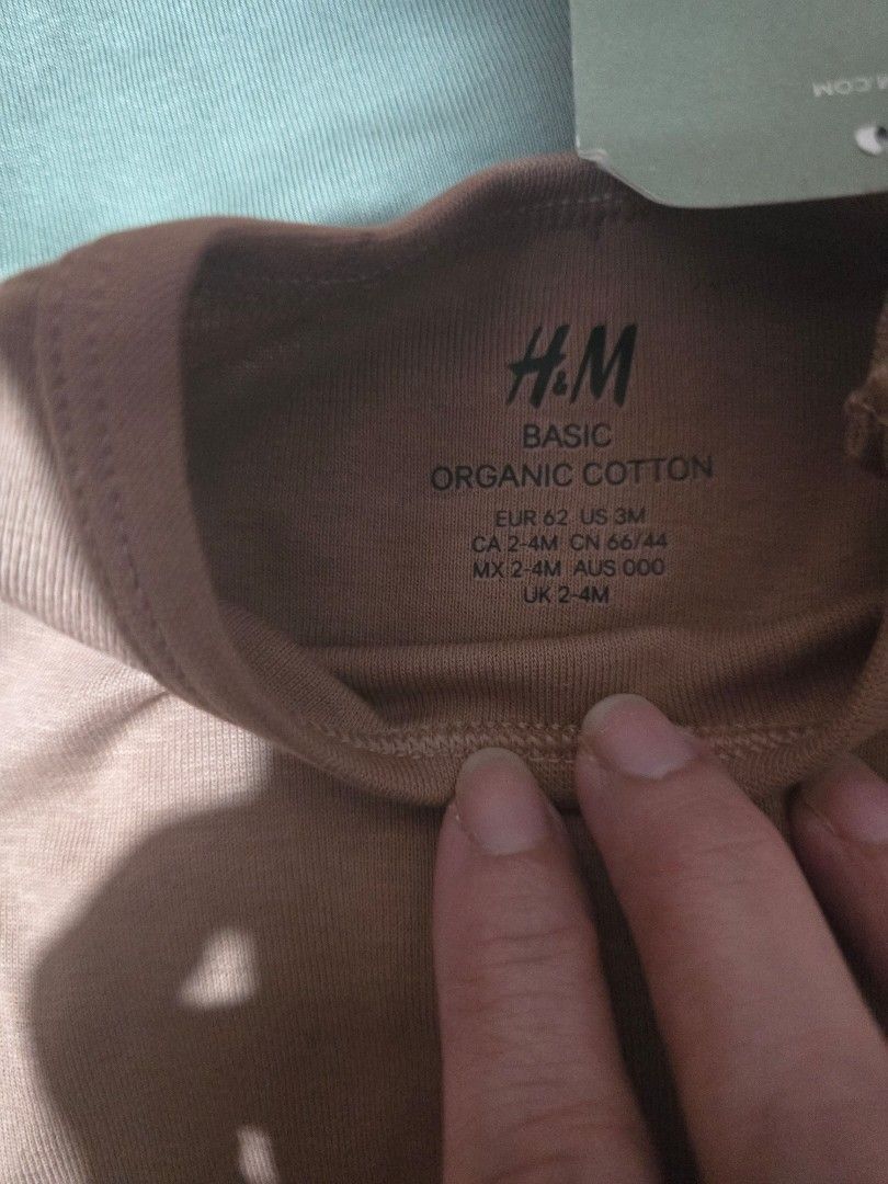 H&M Basic Organic Cotton Long Sleeve Bodysuits (3 Months) (Category: Babies & Kids Fashion) located in Las Pinas. Submitted by luxeprelovedstuff (Listing ID 1456905915, Image 2). Description: - Set of 3 H&M long sleeve bodysuits - Made from soft, organic cotton - Colors: Olive Green, Dark Grey, Brown - Size: EUR 62 (US 3M, CA/MX/UK 2-4M, CN 66/44, AUS 000) - Ideal for everyday wear for your little one.