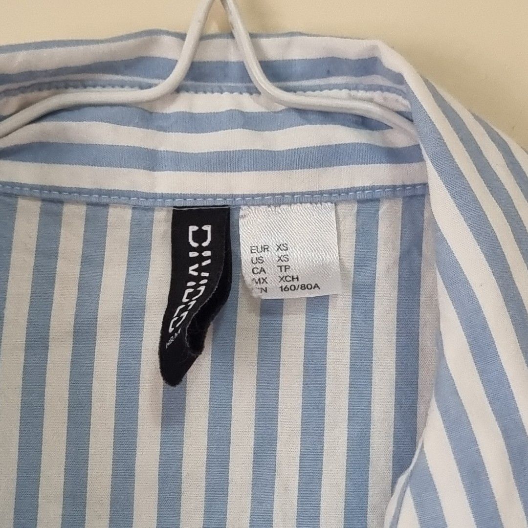 H&M Blue & White Striped Cotton XS Shirt (Category: Shirts) located in Pasig City. Submitted by lesmitch (Listing ID 1456835639, Image 3). Description: ▪︎ L: 28 inc. | W: 20.5 inc. ~ Check all photos for the item's actual condition and measurements ~ Payment is via gcash, pay maya or bdo ~ Shipping is via lalamove, grab, j&t or you can book your own preferred courier ~ There could be a slight difference in color due to lighting conditions. Please
