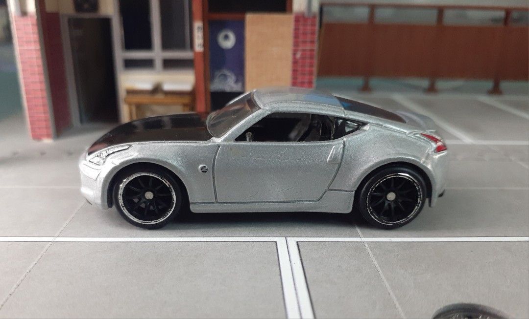 Hotwheels premium Nissan 370z (Category: Vehicle & Diecast Models) located in Manila. Submitted by comercio (Listing ID 1456922463, Image 2). Description: Hotwheels premium Nissan 370z loose .