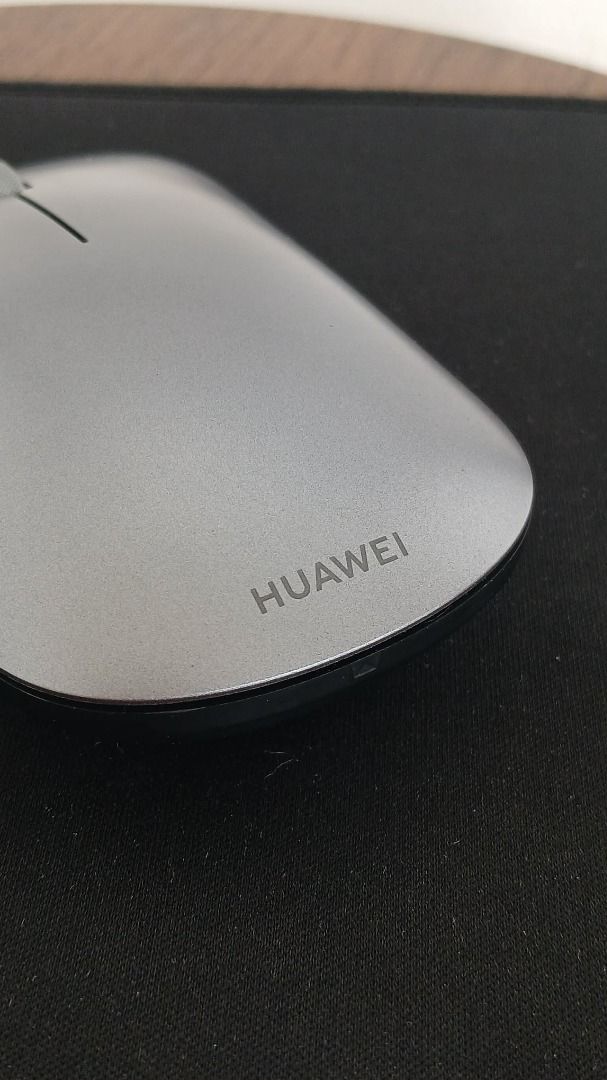 Huawei Wireless Mouse Silver (Category: Mouse & Mousepads) located in Makati City. Submitted by paperboundarchive (Listing ID 1456927767, Image 2). Description: - Classic Gray / Silver - Used as a spare mouse only - Bluetooth 5.0 connectivity - 1200 DPI optical sensor that works on glass surfaces -Multi-device Flash-Switch button supporting up to three paired devices - Powered by 1x AA battery lasting up to 12 months on standard use.