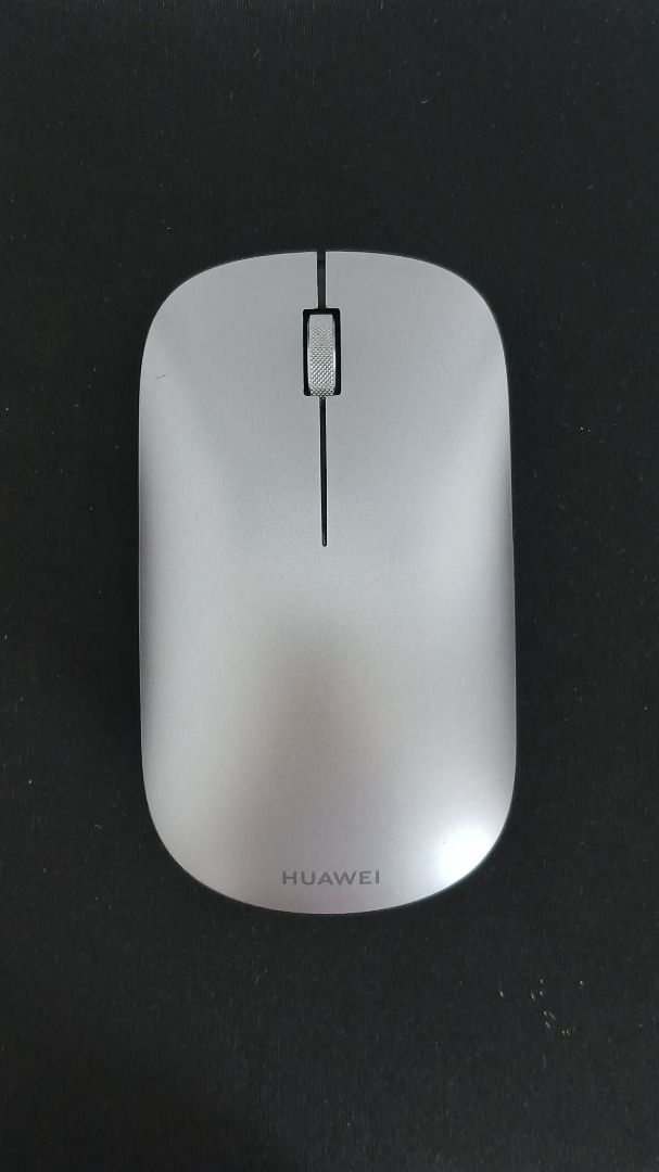 Huawei Wireless Mouse Silver (Category: Mouse & Mousepads) located in Makati City. Submitted by paperboundarchive (Listing ID 1456927767, Image 1). Description: - Classic Gray / Silver - Used as a spare mouse only - Bluetooth 5.0 connectivity - 1200 DPI optical sensor that works on glass surfaces -Multi-device Flash-Switch button supporting up to three paired devices - Powered by 1x AA battery lasting up to 12 months on standard use.