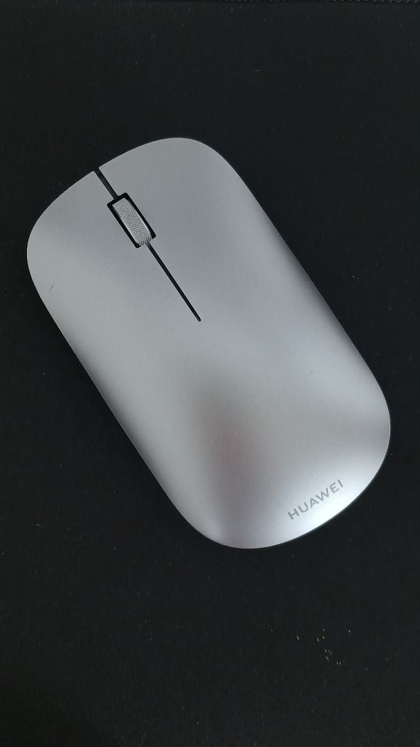 Huawei Wireless Mouse Silver (Category: Mouse & Mousepads) located in Makati City. Submitted by paperboundarchive (Listing ID 1456927767, Image 3). Description: - Classic Gray / Silver - Used as a spare mouse only - Bluetooth 5.0 connectivity - 1200 DPI optical sensor that works on glass surfaces -Multi-device Flash-Switch button supporting up to three paired devices - Powered by 1x AA battery lasting up to 12 months on standard use.